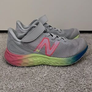 Girls size 13 new balance sneakers. Only worn a few times, excellent condition.